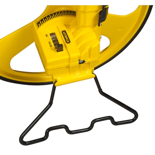 STANLEY 1-77-174 yellow open reel tape measure, close-up photo of winding handle and measurement display.