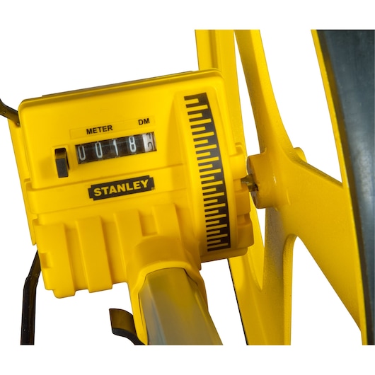 STANLEY 1-77-174 measuring wheel close-up showing yellow counter display and black measurement markings.