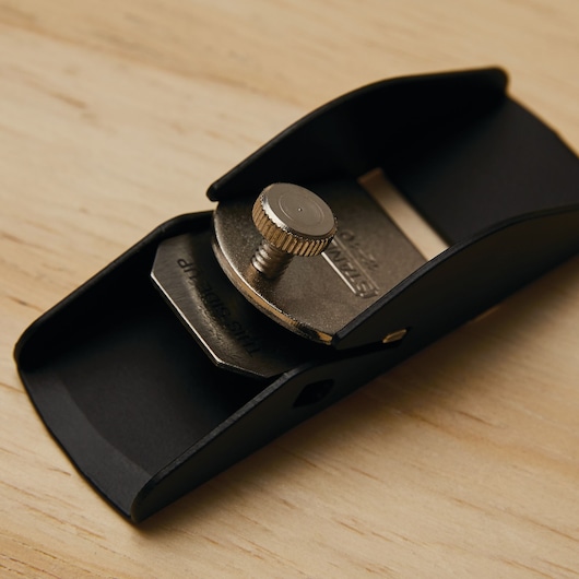 STANLEY 12-101 photography of block plane with metal knob on wooden surface, close-up angle.