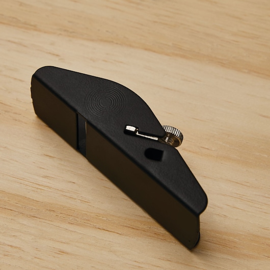STANLEY 12-101 small black block plane with adjustment knob on wood surface.