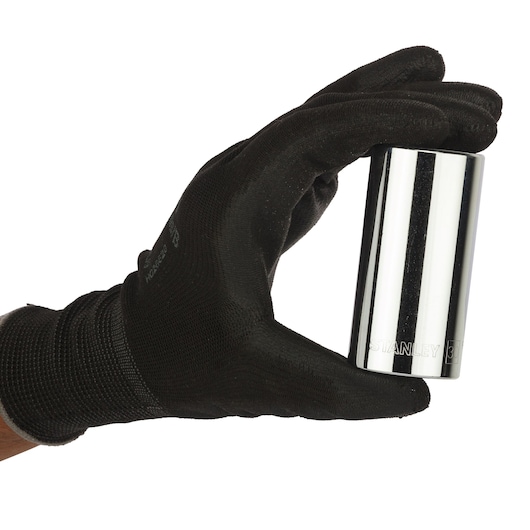 STANLEY 4-86-438 chrome socket held in a black gloved hand, side angle on white background.