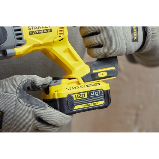 Photo of STANLEY SBH900 Fatmax V20 4.0Ah lithium ion power tool being held by gloved hands.