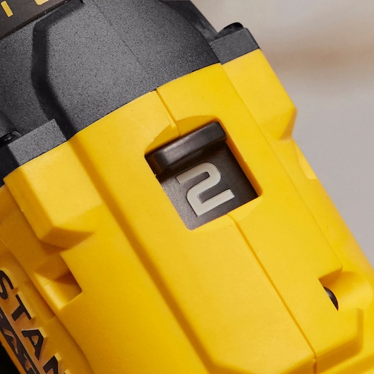 Photo of STANLEY SCD700 drill speed selector showing setting 2, close-up detail, yellow and black housing.