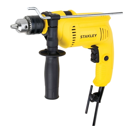 STANLEY SDH600K yellow corded electric drill with side handle and depth gauge, front right angle, on white background.