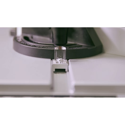 STANLEY SST2001-B2 miter saw close-up showing angle adjustment guide on white background.