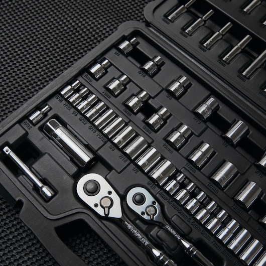 STANLEY STMT71651 photography of chrome socket set and ratchets in a black molded case, angled view.