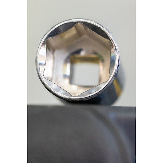 STANLEY STMT82828-LA socket tool close-up showing hexagonal interior and metallic finish.