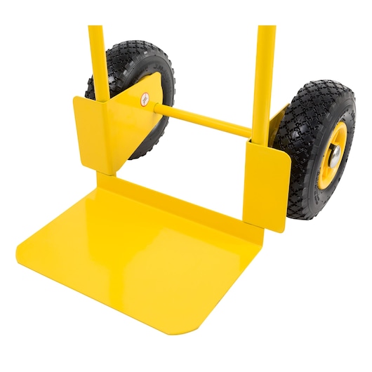 STANLEY STST98367 yellow hand truck side angle with black textured wheels and flat loading base.