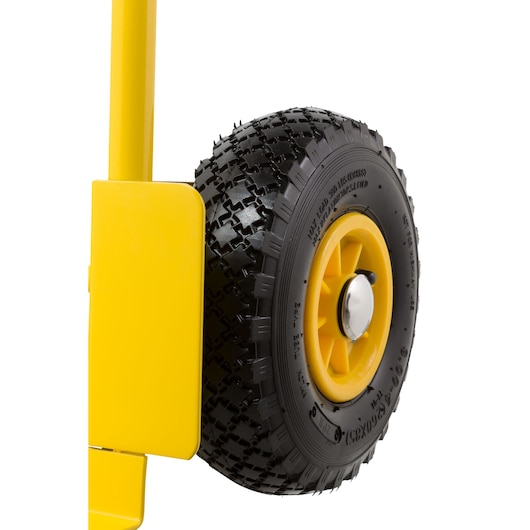 STANLEY STST98367 photography of yellow hand truck wheel with black tread, side angle view.