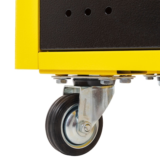 Photo of STANLEY STST98521LA tool chest caster wheel, yellow and black, close-up side angle.